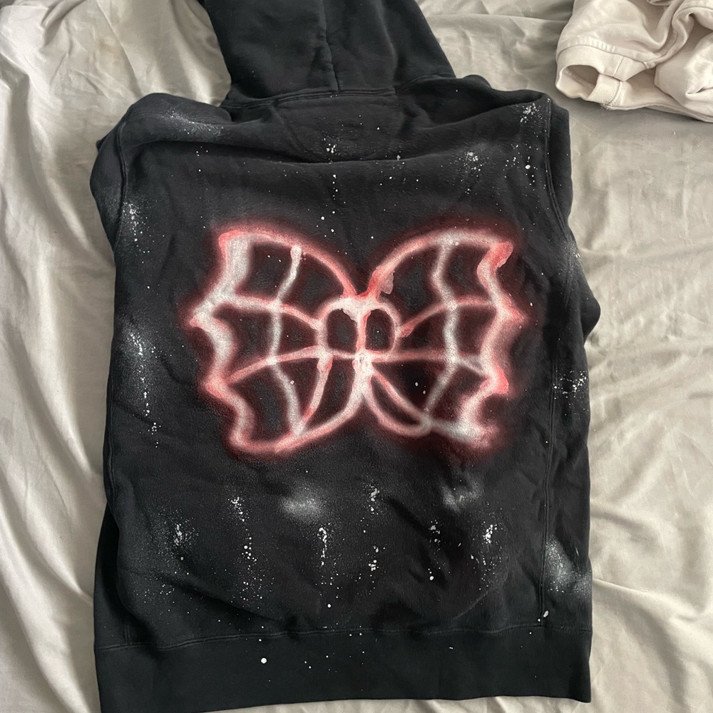 Black Hoodie with Red and White Bow Graphic